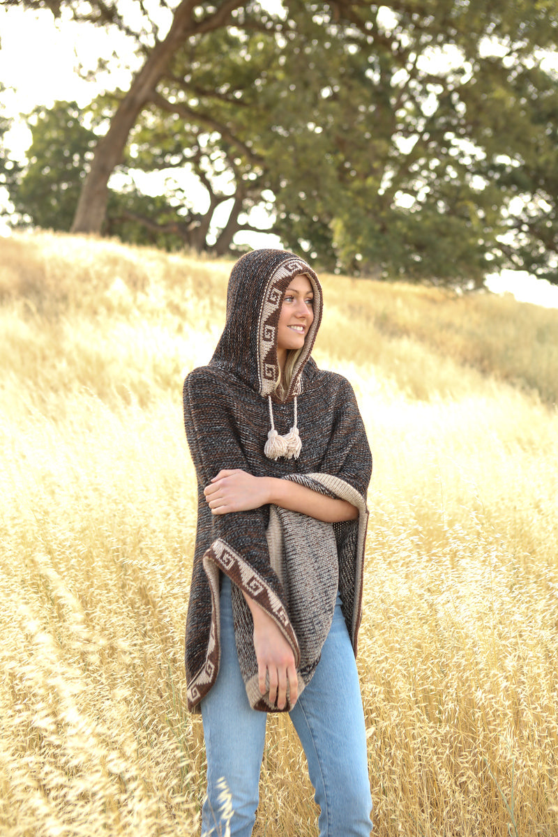 Poncho with hoodie and ethnic design