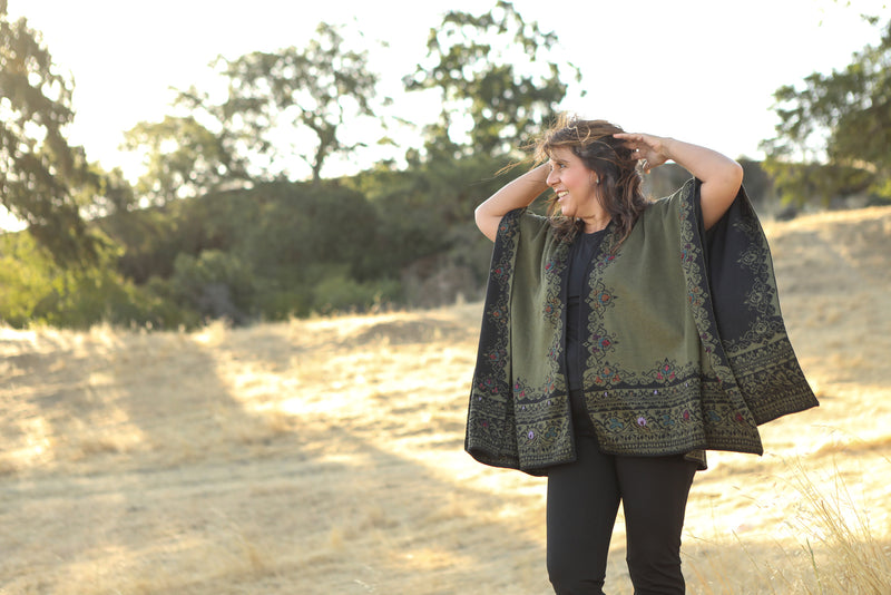 Cape reversible with applications by hand