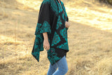 Cape reversible with applications by hand