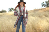 Long length cardigan with multiple designs on arms and collar