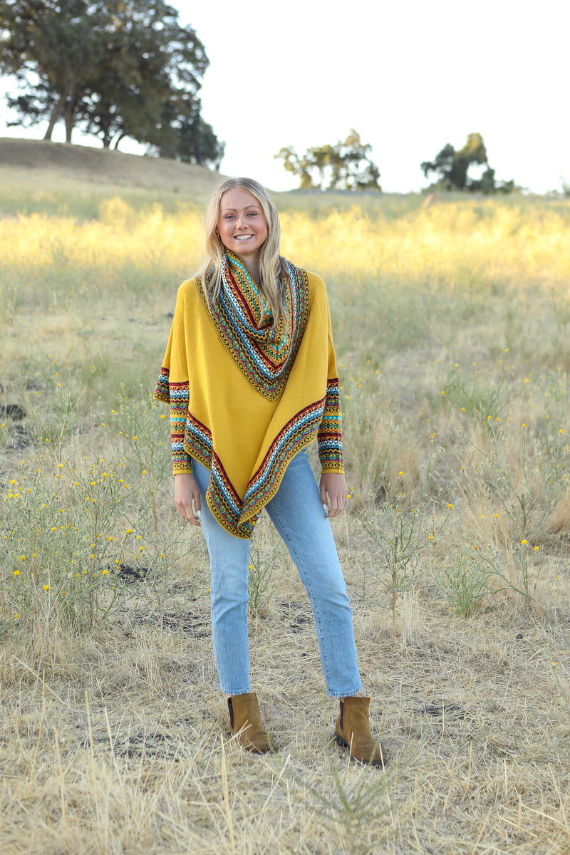 Poncho with neck warmer and sleeves